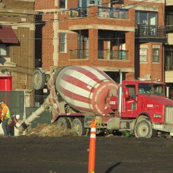 Another view of the concrete mixing truck in the northeast corner of the triangle lot next to Gate K