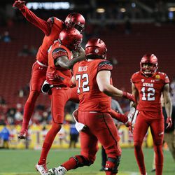 Utah Utes quarterback Tyler Huntley (1) celebrates a touchdown with teammates as the Utes and the Hoosiers play in the Foster Farms Bowl in Santa Clara, California on Wednesday, Dec. 28, 2016.