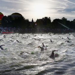 Participants compete on the swim leg during the Challenge Roth on July 20, 2014 in Roth, Germany. (Photo by Alex Grimm/Getty Images)