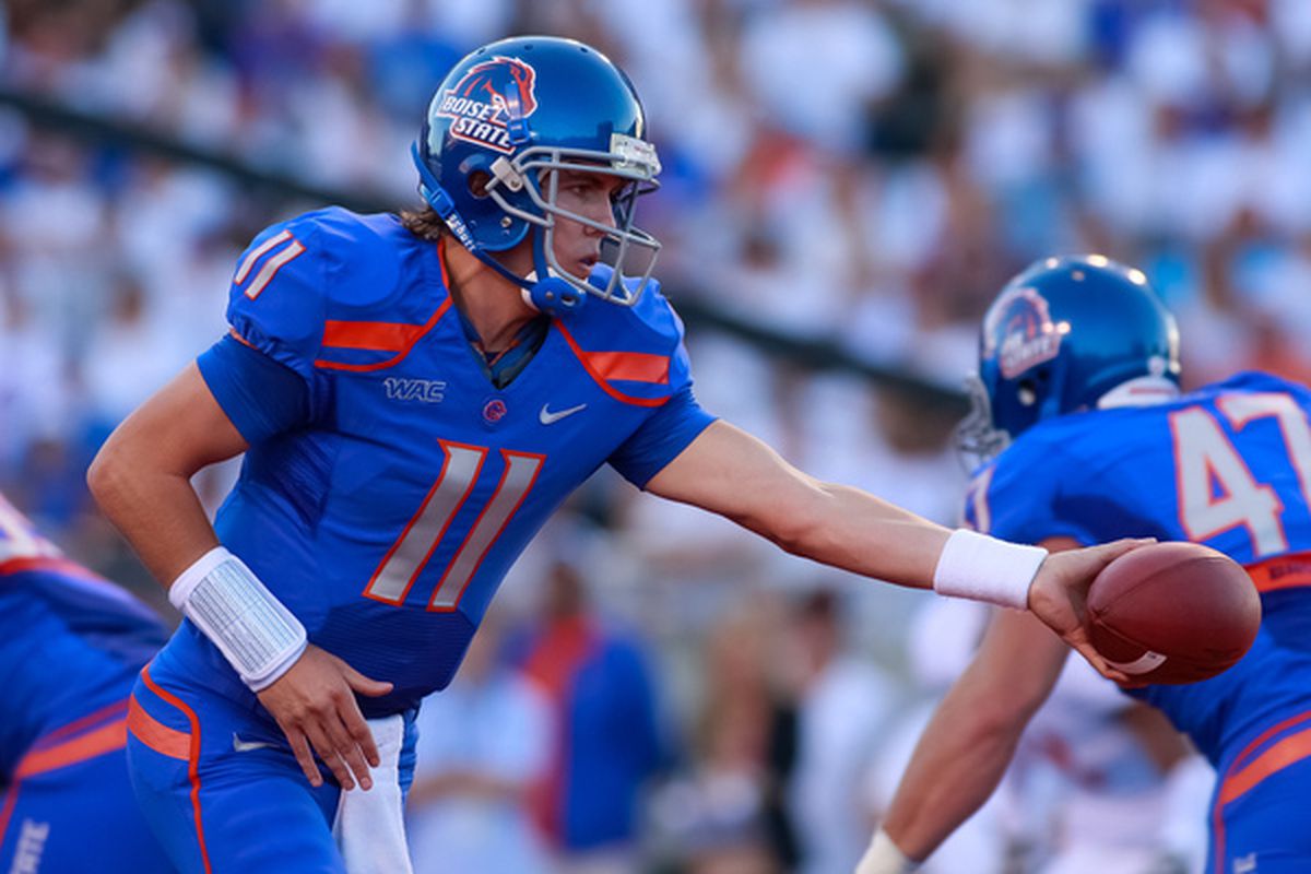 BOISE ID - SEPTEMBER 25:  Quarterback Kellen Moore #11 of the Boise State Broncos hands off the ball against the Oregon State Beavers at Bronco Stadium on September 25 2010 in Boise Idaho.  (Photo by Otto Kitsinger III/Getty Images)