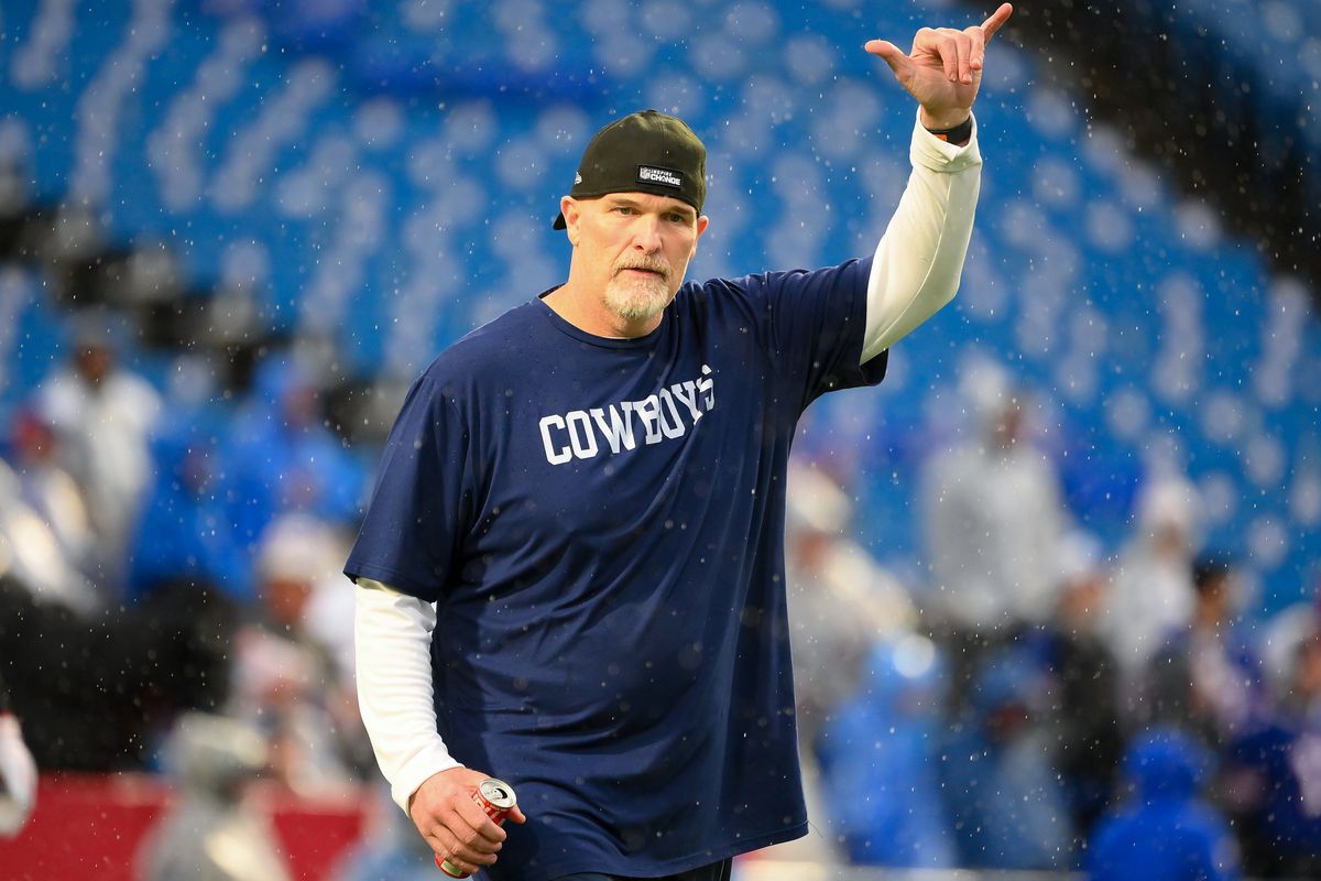 Defensive coordinator Dan Quinn of the Dallas Cowboys gestures to fans prior to the game prior to the game against the Buffalo Bills at Highmark Stadium on December 17, 2023 in Orchard Park, New York. The Bills won 31-10.