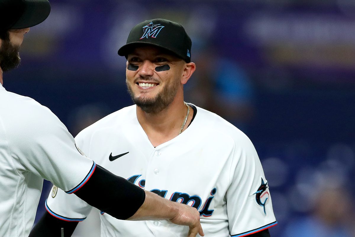 Dylan Floro #36 and Miguel Rojas #11 of the Miami Marlins celebrate after defeating the Philadelphia Phillies at loanDepot park on September 15, 2022 in Miami, Florida.