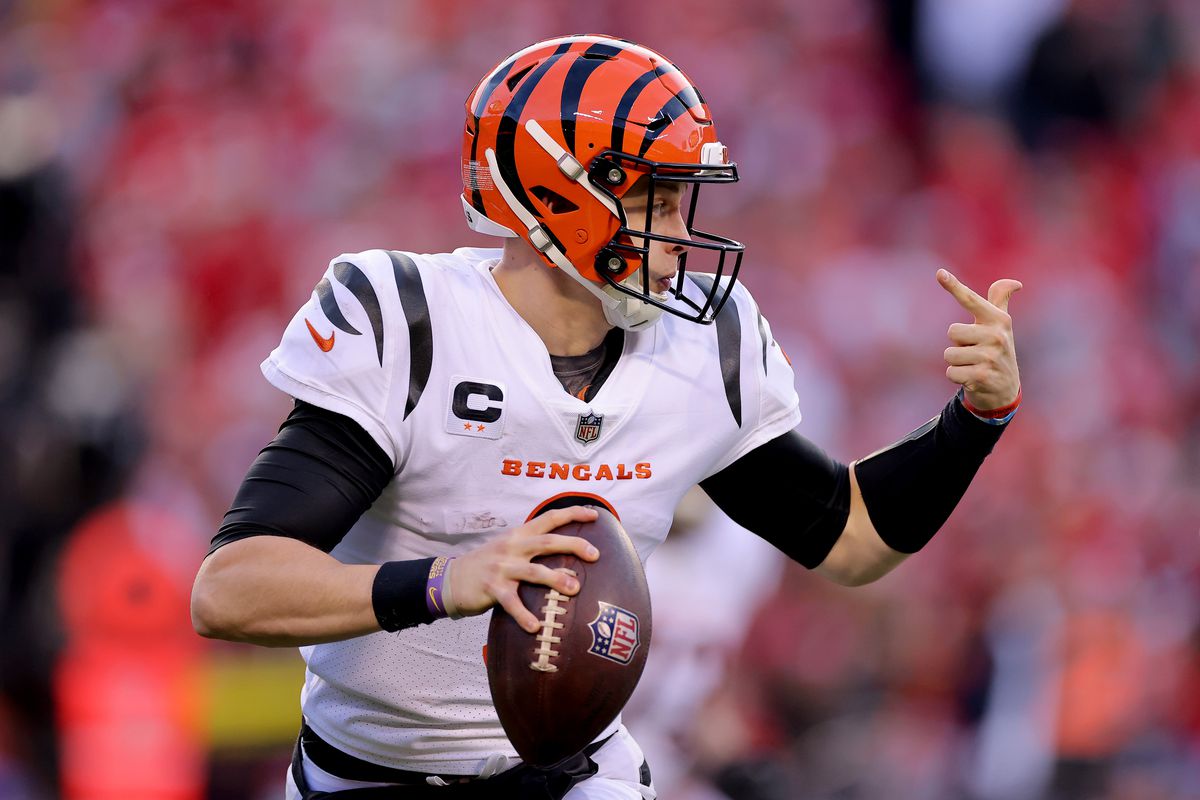 Quarterback Joe Burrow #9 of the Cincinnati Bengals rolls out to pass against the Kansas City Chiefs during the second half of the AFC Championship Game at Arrowhead Stadium on January 30, 2022 in Kansas City, Missouri.