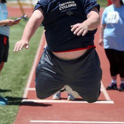 Simon Stonebaker, of Provo, competes in the final round of the standing long jump at the Special Olympics Utah 2013 Harmons Summer Games at Herriman High School in Herriman on Thursday, June 13, 2013.