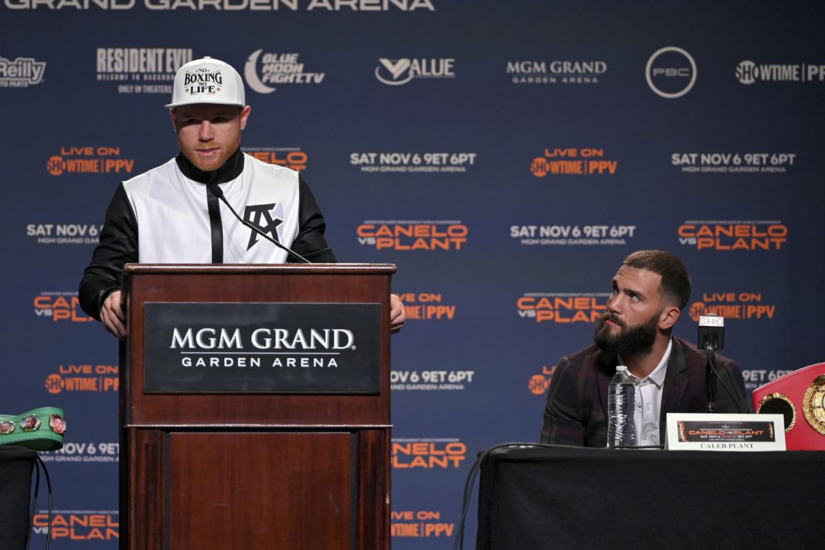 WBC/WBA/WBO super middleweight champion Canelo Alvarez (L) speaks as IBF super middleweight champion Caleb Plant looks on during a news conference at MGM Grand Garden Arena on November 03, 2021 in Las Vegas, Nevada.