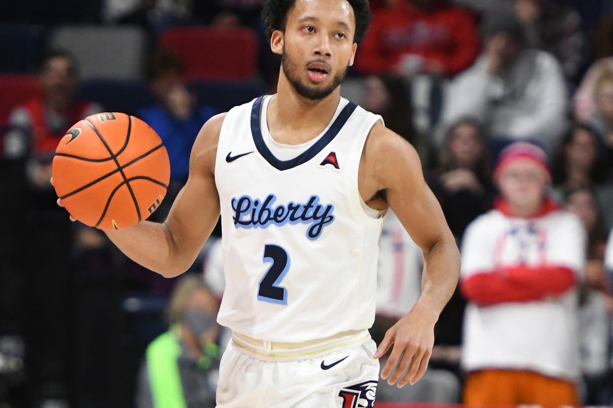 Darius McGhee of the Liberty Flames dribbles up court during a college basketball game against the North Alabama Lions at the Liberty Arena on January 27, 2022 in Lynchburg, Virginia.