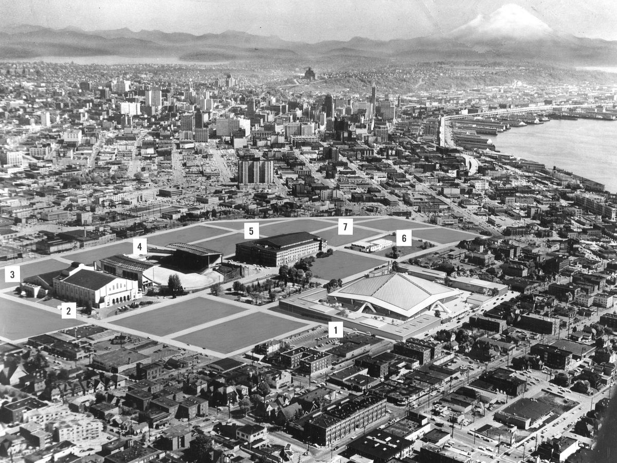 An aerial map of Seattle Center in black and white, with some buildings shown but others as blank, gray tracts, with different areas numbered.