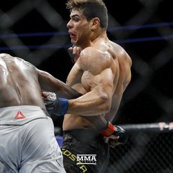 Paulo Costa lands another body shot at UFC 226.