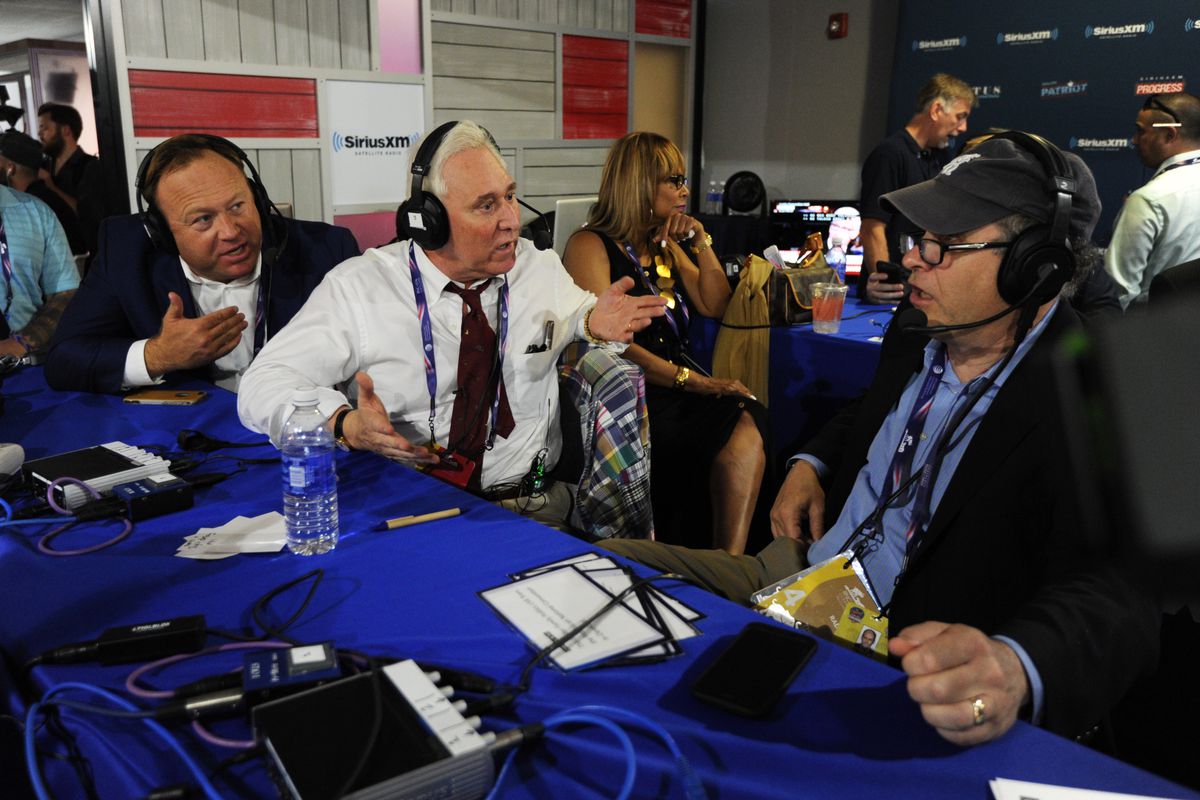 Alex Jones alongside Roger Stone and Jonathan Alter at the Republican National Convention, which would nominate Donald Trump for the presidency, in July 2016.