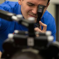 Clint Prestwich, an optometry student, gives a child an eye exam during SightFest at the Jordan School District Auxiliary Services building in West Jordan on Thursday, Dec. 8, 2016. SightFest is a partnership between Friends for Sight and the Utah Optometric Association that on Thursday provided free eye exams and glasses for 125 students from Title I schools in the Jordan School District.