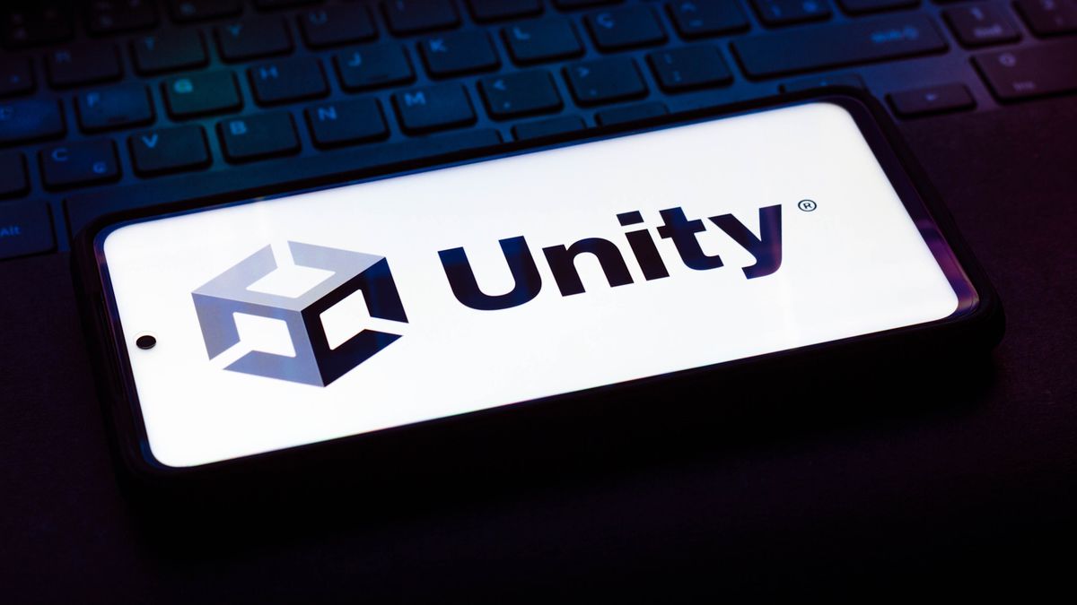 In this photo illustration the Unity Technologies logo is seen on a laptop keyboard