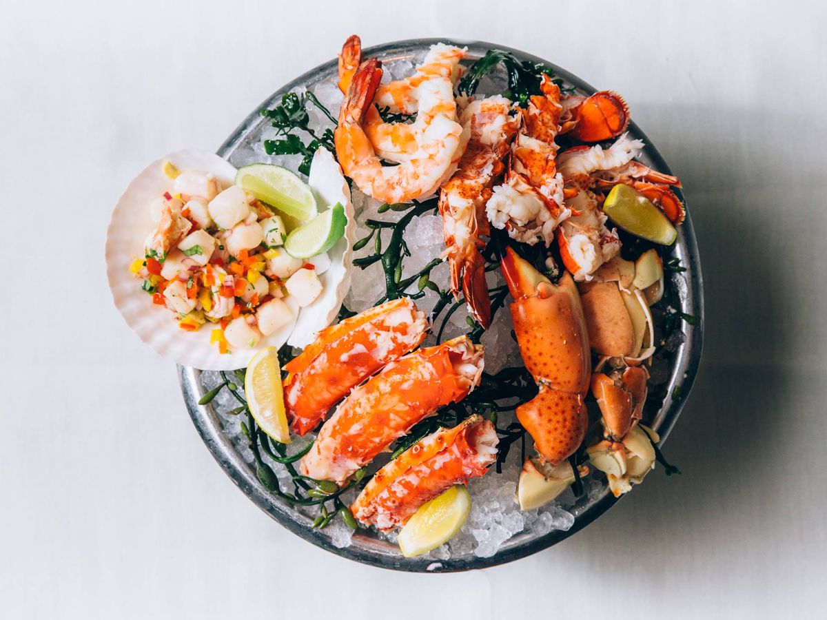 joe’s stone crab seafood platter on white background.