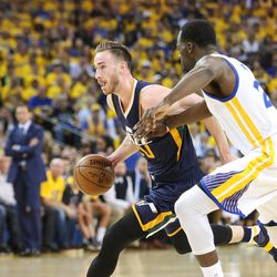 Utah Jazz forward Gordon Hayward (20) moves against Golden State Warriors forward Draymond Green (23) in the first half of game 2 of the NBA Western Conference Semifinals at Oracle Arena in Oakland, Calif. on Thursday, May 04, 2017.