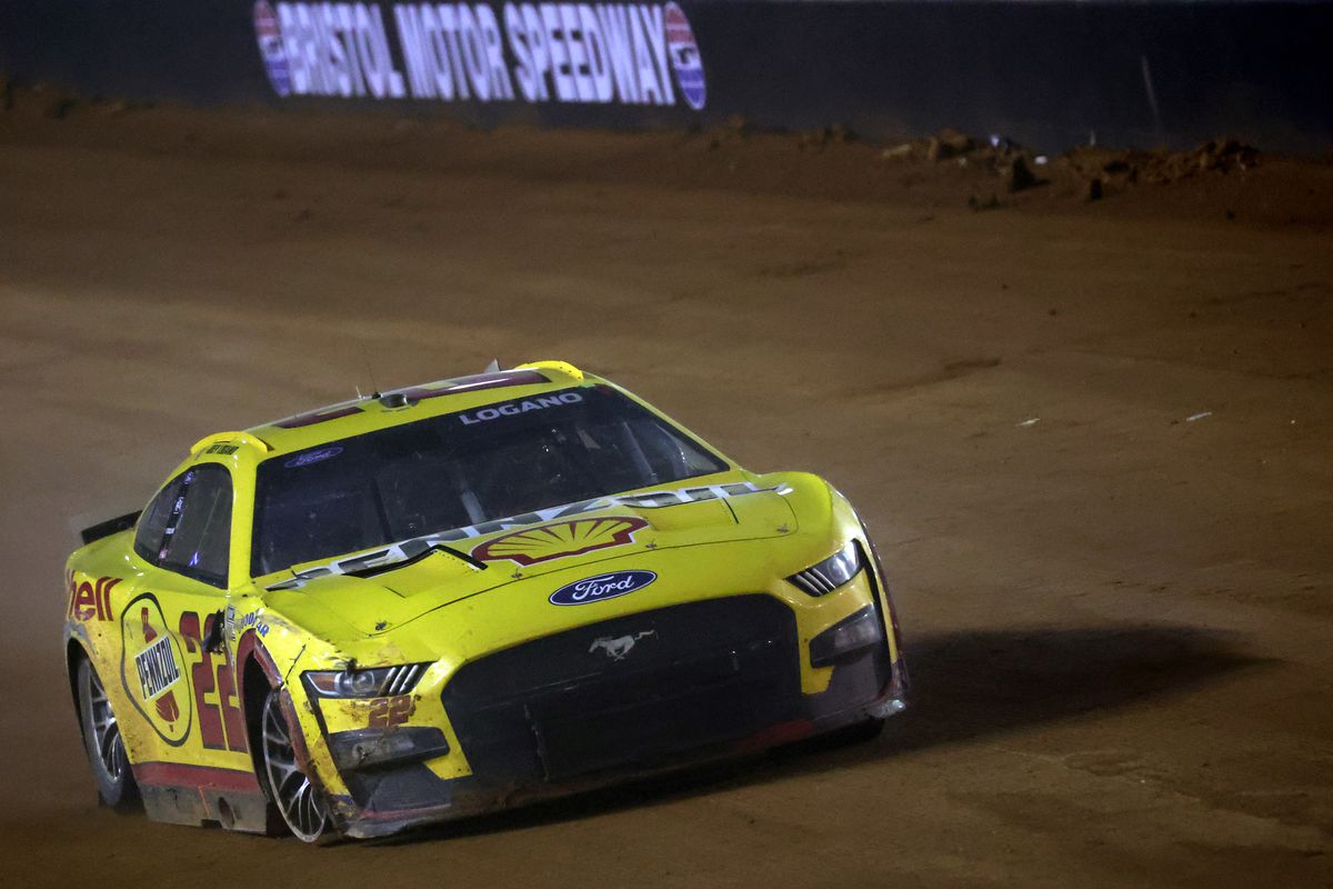 Joey Logano, driver of the #22 Shell Pennzoil Ford, drives a damaged car during the NASCAR Cup Series Food City Dirt Race at Bristol Motor Speedway on April 09, 2023 in Bristol, Tennessee.