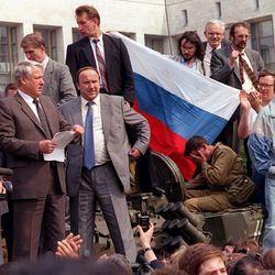 Boris Yeltsin, president of the Russian Federation, makes a speech from atop a tank in front of the Russian parliament building in Moscow, U.S.S.R., Monday, Aug. 19, 1991. Yeltsin called on the Russian people to resist the communist hard liners in the Soviet coup.