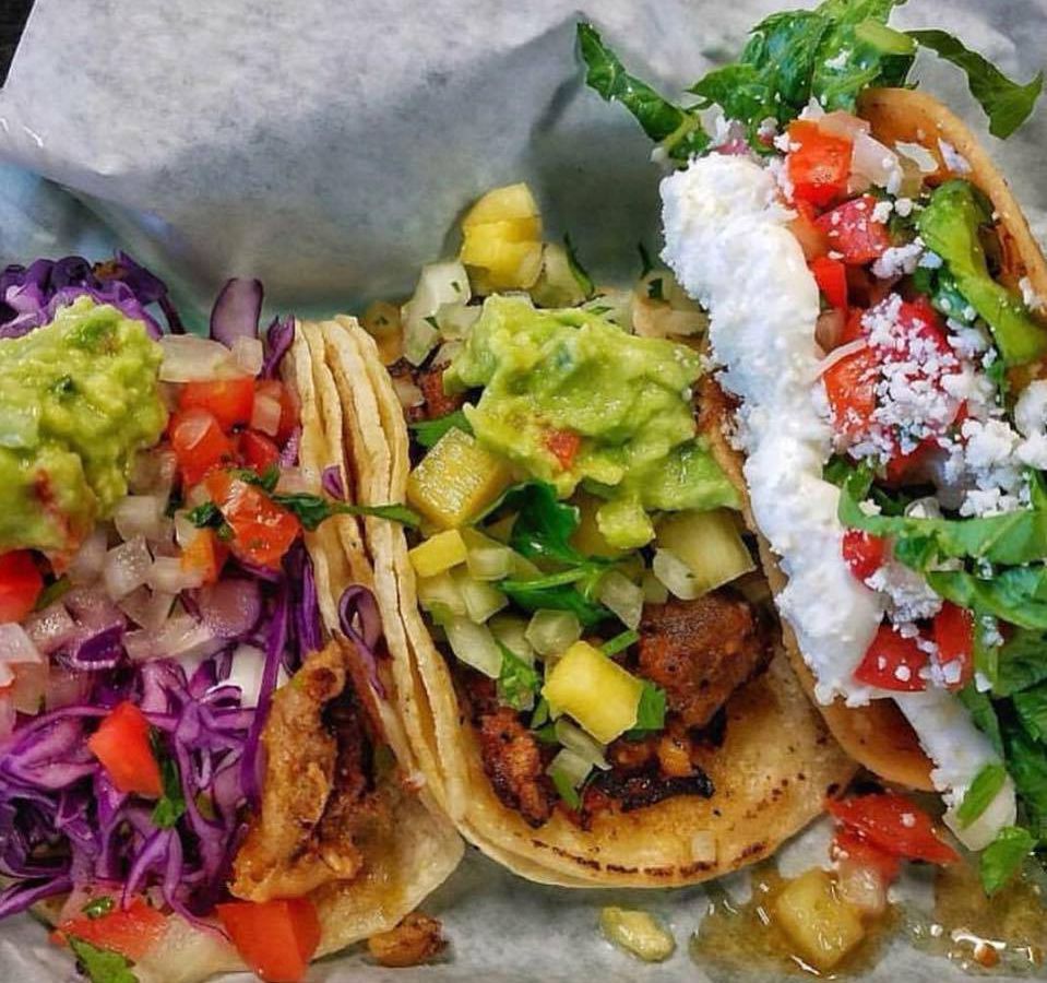 Three colorful tacos