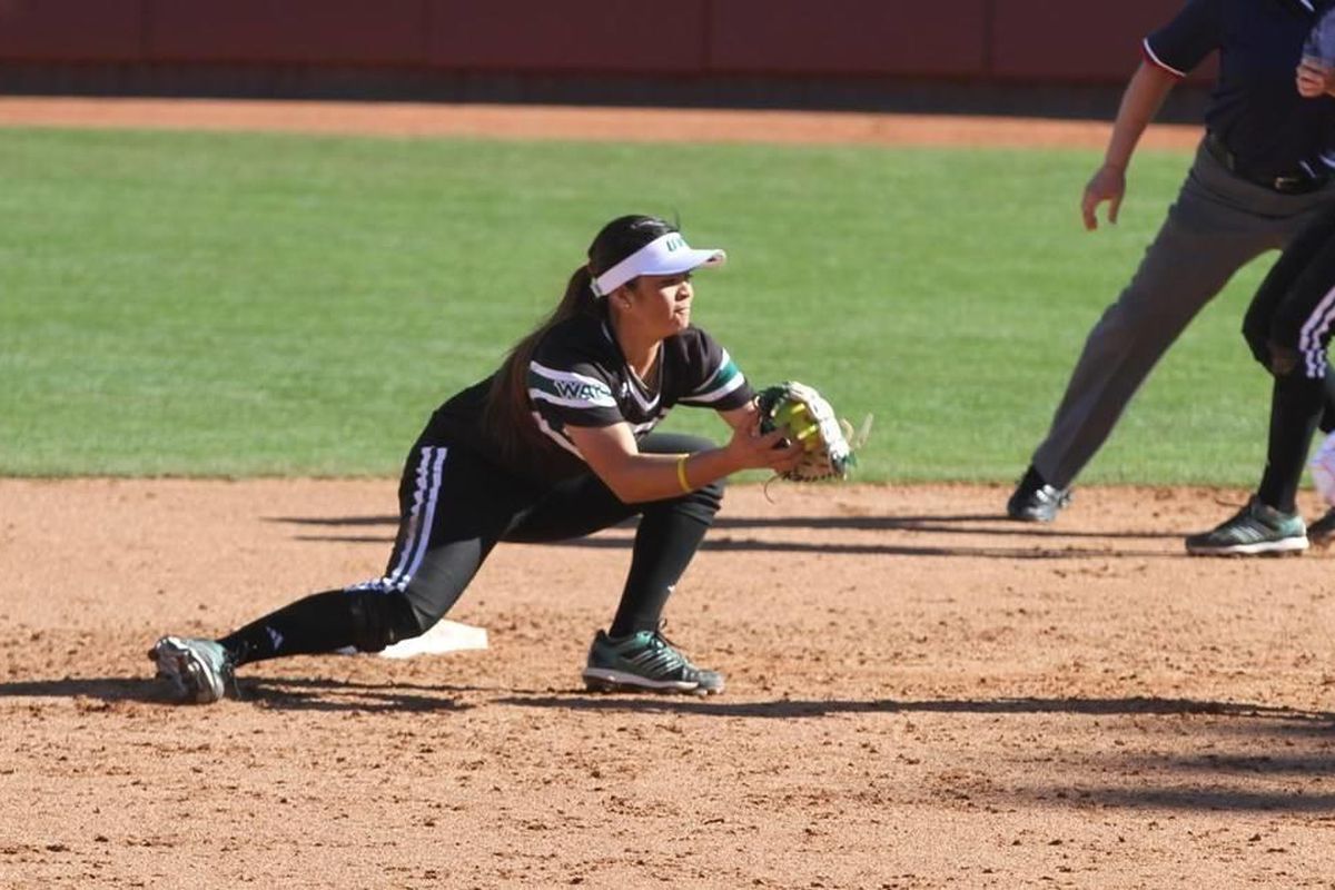 Junior Tiani Hensley lowers to catch the ball. Hensley went 3-for-5 at the plate on Friday with five RBIs. 