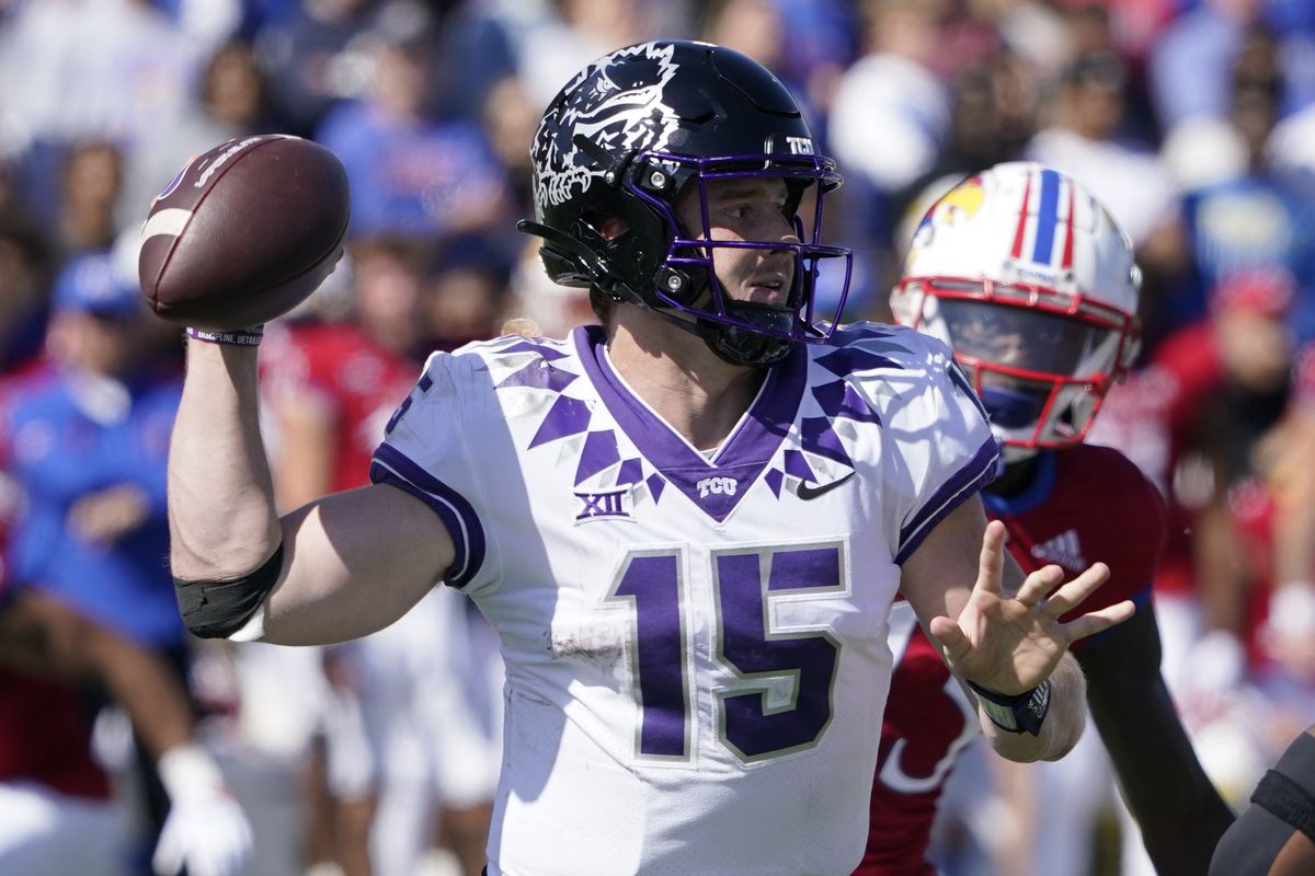 Quarterback Max Duggan #15 of the TCU Horned Frogs passes in the second half against against the Kansas Jayhawks at David Booth Kansas Memorial Stadium on October 08, 2022 in Lawrence, Kansas.
