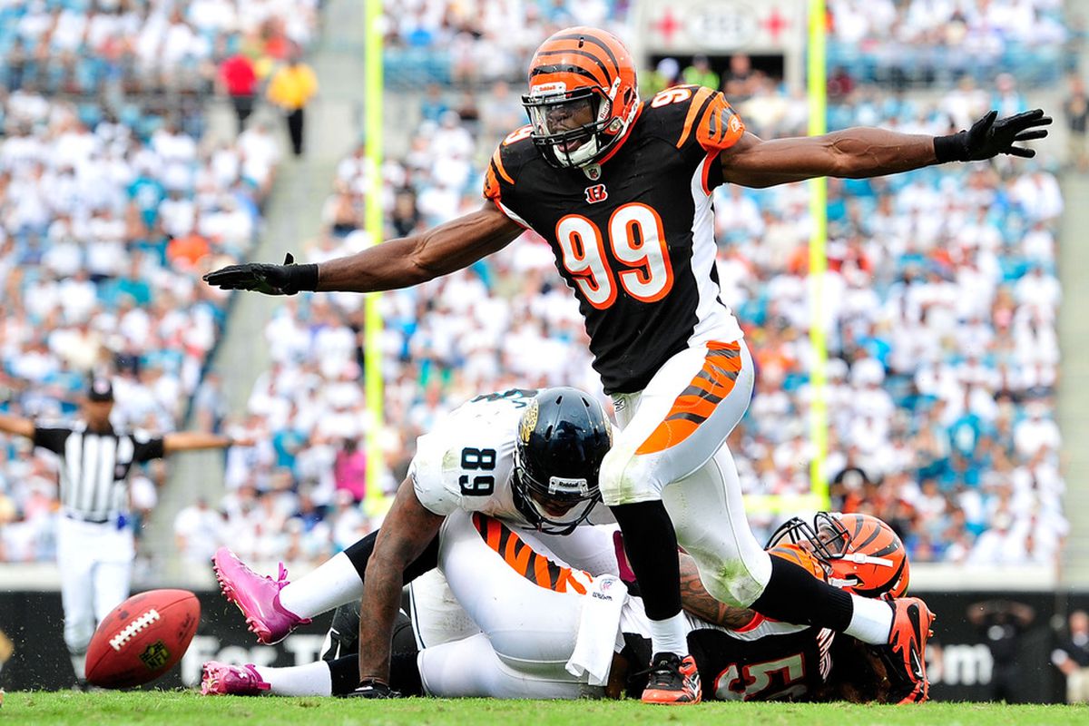 Manny Lawson #99 of the Cincinnati Bengals reacts after breaking up a pass