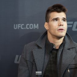 Mickey Gall answers a question at UFC 235 media day.