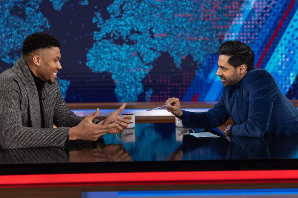 Giannis sitting with Hasan Minaj during his appearance on the Daily Show
