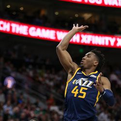 Utah Jazz guard Donovan Mitchell (45) shoots during the game against the Boston Celtics at Vivint Smart Home Arena in Salt Lake City on Wednesday, March 28, 2018.