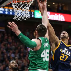 Utah Jazz center Rudy Gobert (27) and Boston Celtics center Aron Baynes (46) compete for a rebound at Vivint Smart Home Arena in Salt Lake City on Wednesday, March 28, 2018.