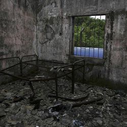 In this photo taken Tuesday, May, 8. 2012, showing a burnt out bed at the former prison known as Tekunle on Ita Oko Island outside of Lagos, Nigeria.