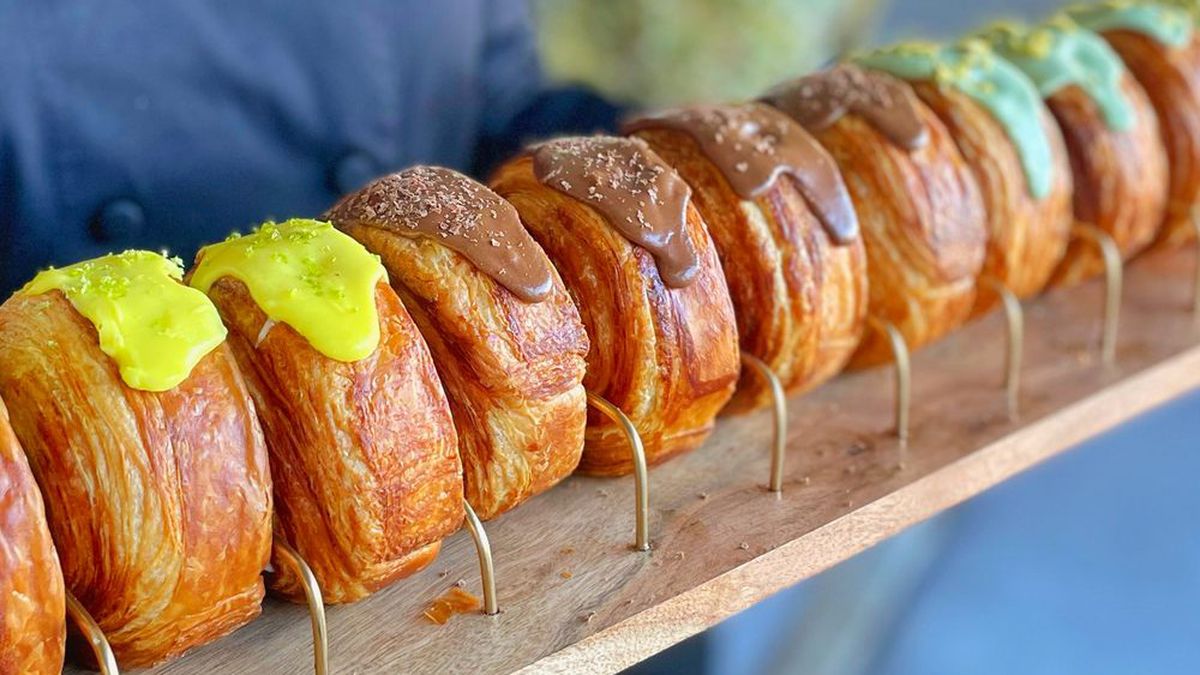 A row of spiral croissants topped in green or brown glaze from Marvel Cake in Campbell, California.
