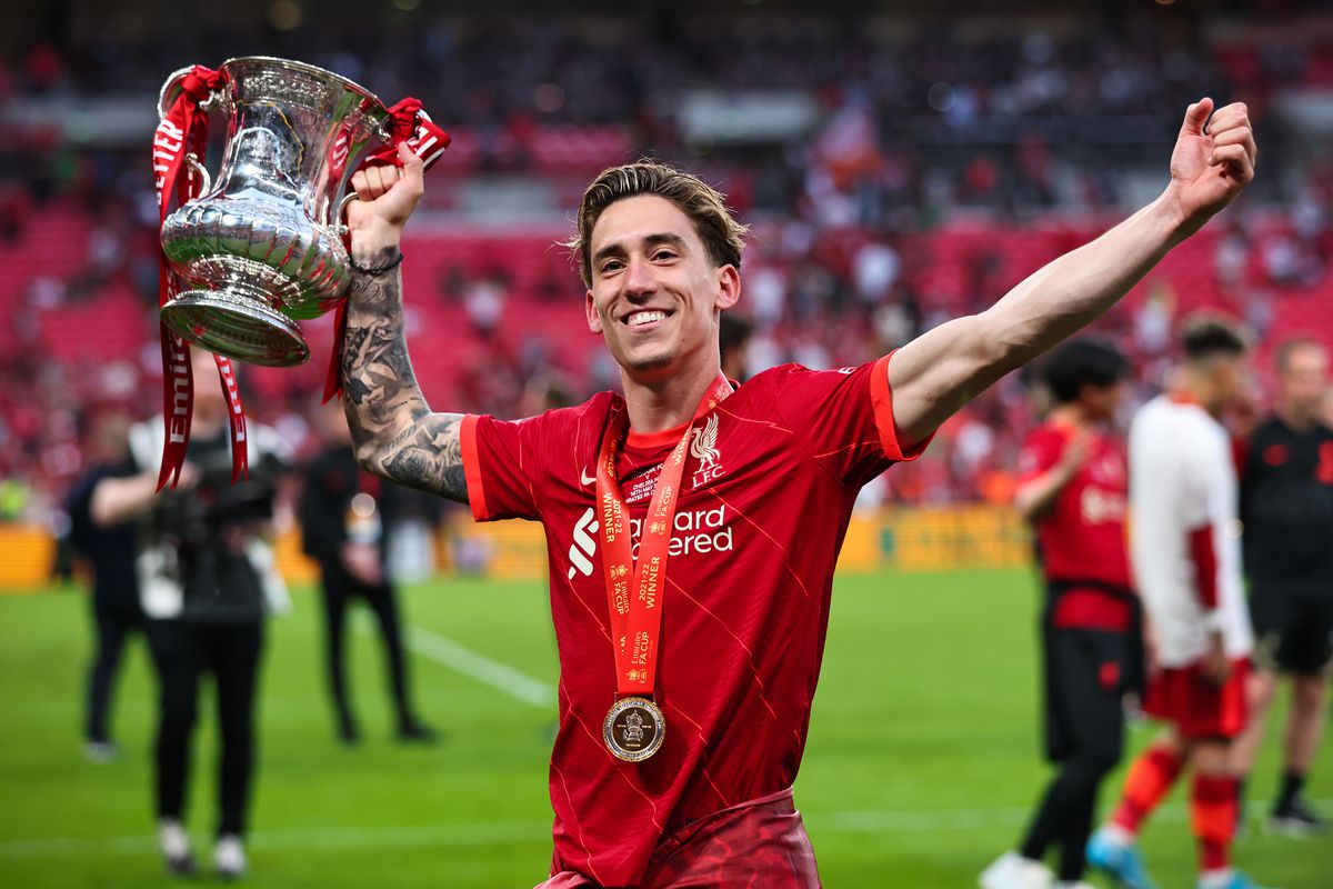Kostas Tsimikas of Liverpool celebrates with the Emirates FA Cup trophy following his team’s victory in The FA Cup Final match between Chelsea and Liverpool at Wembley Stadium on May 14, 2022 in London, England.
