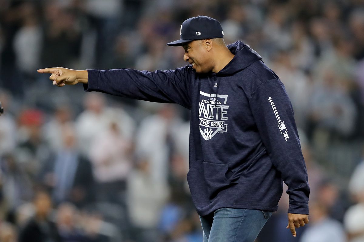 Bernie Williams throws out the first pitch prior to the American League Wild Card Game between the Oakland Athletics and the New York Yankees at Yankee Stadium on October 03, 2018.