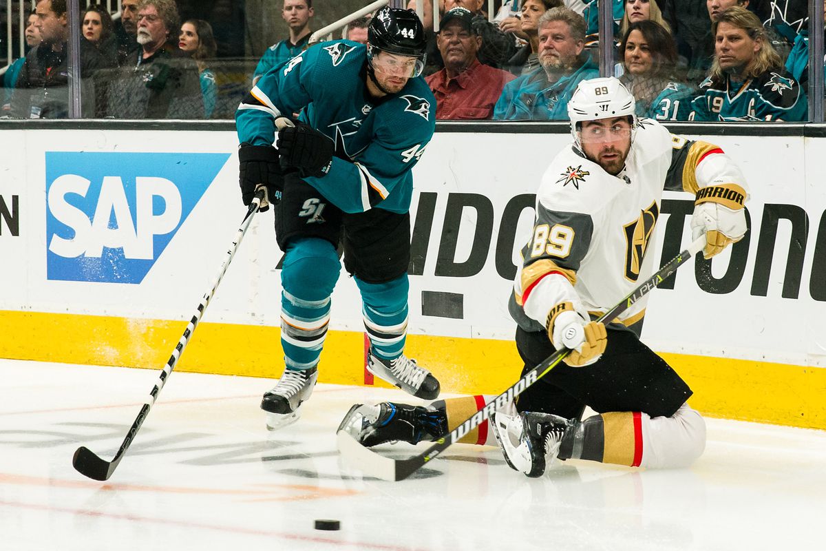 San Jose Sharks defenseman Marc-Edouard Vlasic (44) and Vegas Golden Knights right wing Alex Tuch (89) battle for control of the puck in the first period of game five of the first round of the 2019 Stanley Cup Playoffs at SAP Center at San Jose.