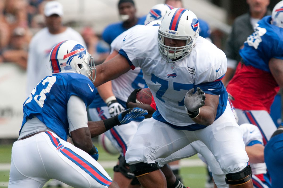August 13, 2012; Pittsford, NY, USA; Buffalo Bills rookie tackle Cordy Glenn (77) handles a pass rusher during training camp at St. John Fisher College.  Mandatory Credit: Mark Konezny-US PRESSWIRE