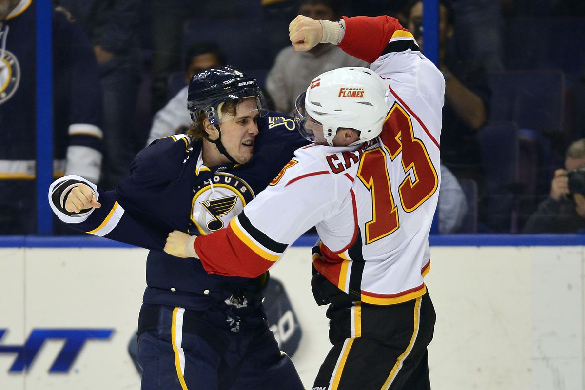 Kris Russell fights Flames forward Mike Cammalleri. 