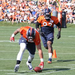 DE Derek Wolfe keeps a loose ball in bounds for NT Sylvester Williams to pick up in loose ball drills