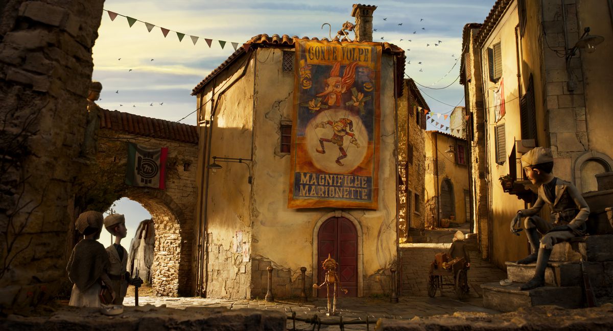 Pinocchio stands in the street of his Italian village under a circus poster.  There's a monkey on the roof