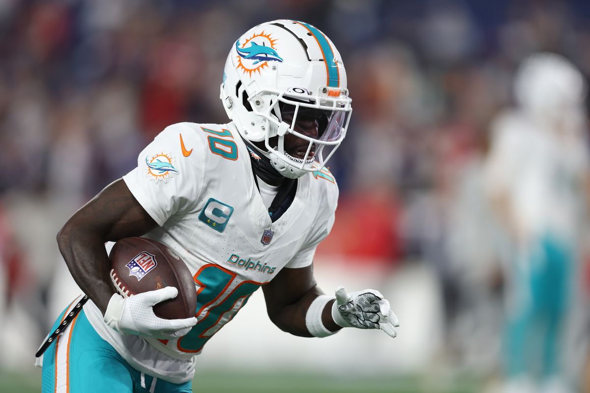 Tyreek Hill #10 of the Miami Dolphins warms up before the game against the New England Patriots at Gillette Stadium on September 17, 2023 in Foxborough, Massachusetts.