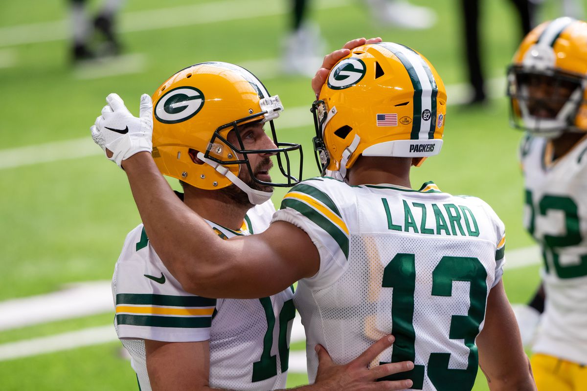 Green Bay Packers quarterback Aaron Rodgers congratulates wide receiver Allen Lazard after his touchdown in the fourth quarter against the Minnesota Vikings at U.S. Bank Stadium.&nbsp;