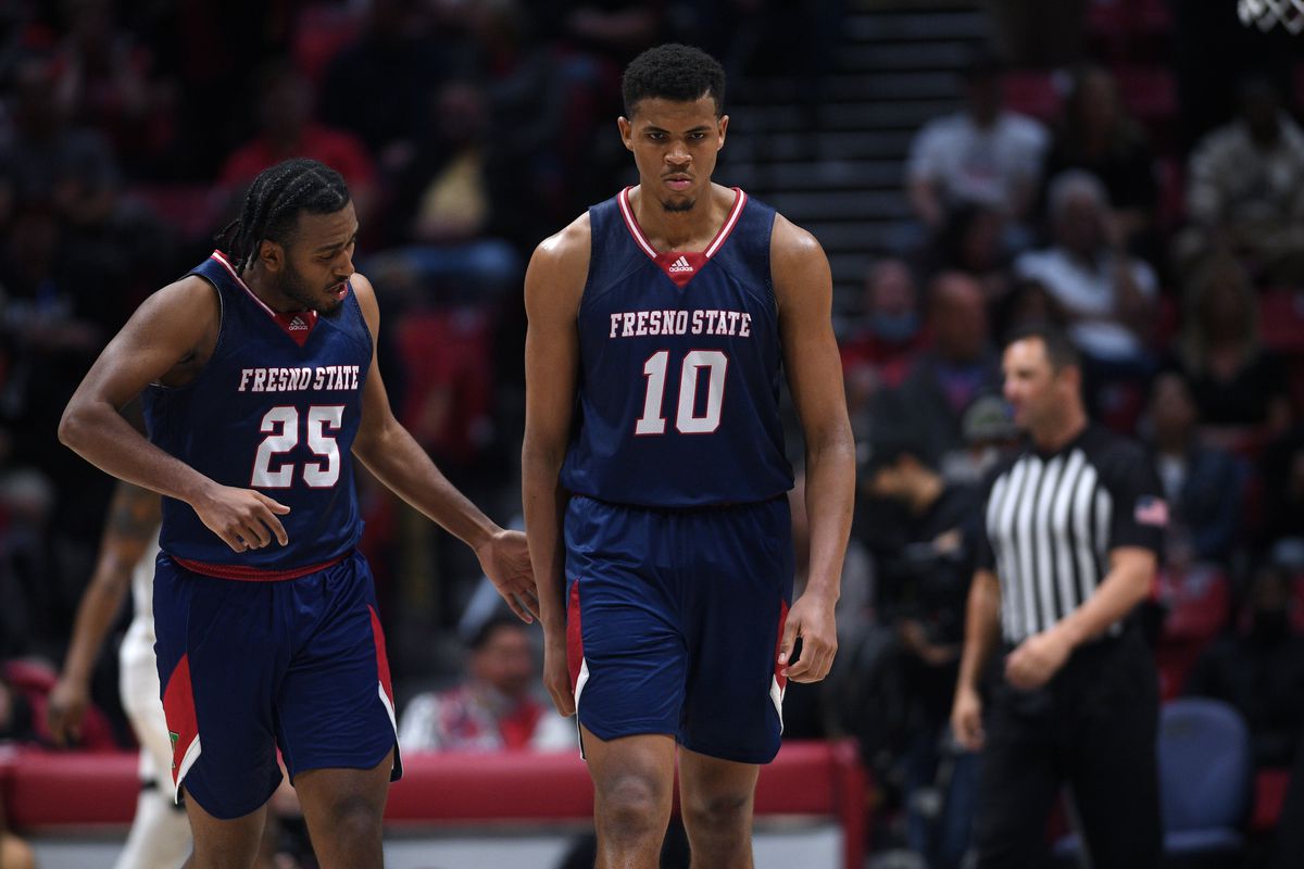 Fresno State Bulldogs forward Orlando Robinson and guard Anthony Holland react during the second overtime against the San Diego State Aztecs at Viejas Arena.