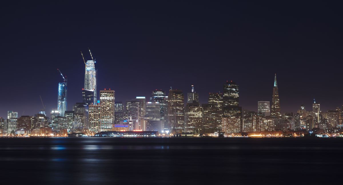 A night photo of the SF skyline.