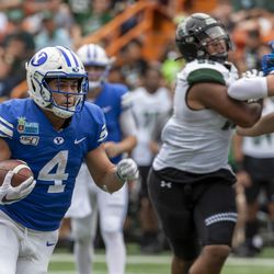 BYU running back Lopini Katoa (4) runs with the football during the first half of the team’s Hawaii Bowl NCAA college football game against Hawaii, Tuesday, Dec. 24, 2019, in Honolulu.