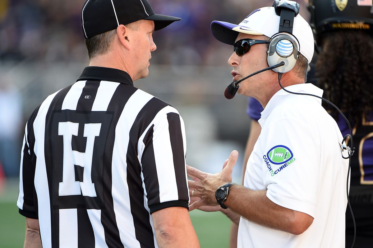 Chris Petersen is seen here discussing the finer points of blitz pickups with an unidentified zebra.