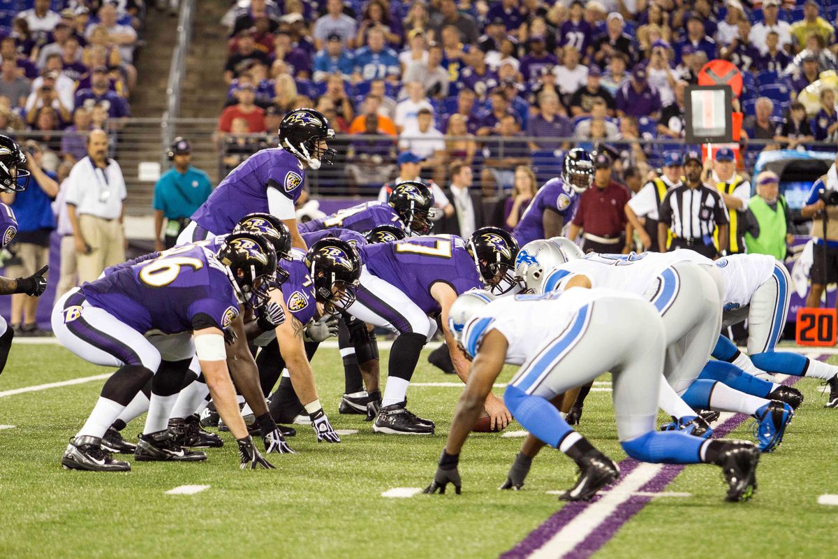 Aug 17, 2012; Baltimore, MD, USA; General view as Baltimore Ravens quarterback Joe Flacco prepares to take the snap against the Detroit Lions defense during the first quarter at M&T Bank Stadium.  Mandatory Credit: Paul Frederiksen-US PRESSWIRE