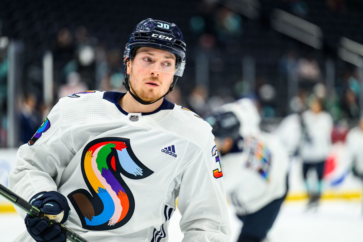 Jesper Froden of the Seattle Kraken skates on the ice during warm-ups in his special Pride Night jersey.