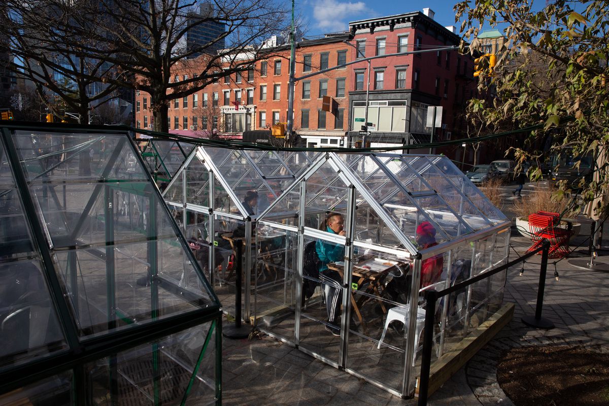 People eat outside in Fort Greene, Brooklyn during the coronavirus outbreak, Dec. 29, 2020.