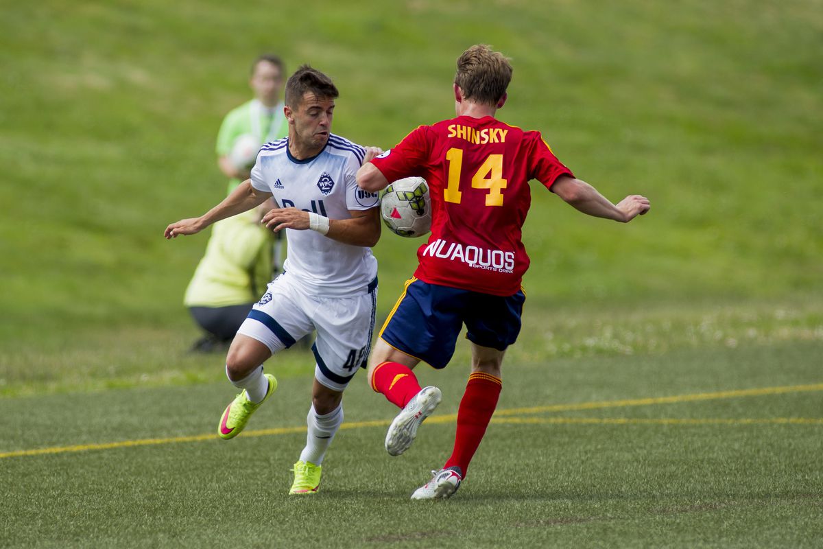 Victor Blasco (L) and Arizona United's Alex Shinsky fight for the ball during a match at Thunderbird Stadium on Sunday afternoon.  WFC2 won the match 2-0.