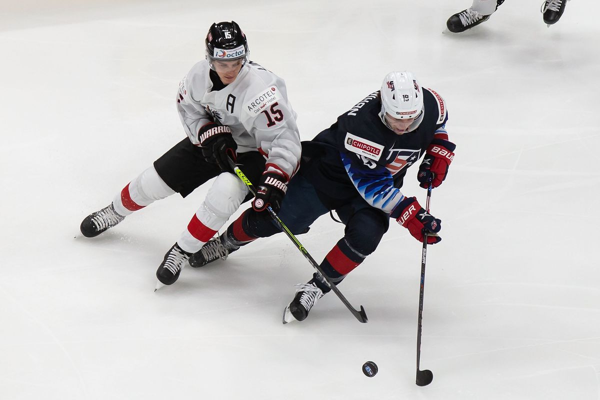 Patrick Moynihan #19 of the United States skates against Luis Lindner #15 of Austria during the 2021 IIHF World Junior Championship at Rogers Place on December 26, 2020 in Edmonton, Canada.