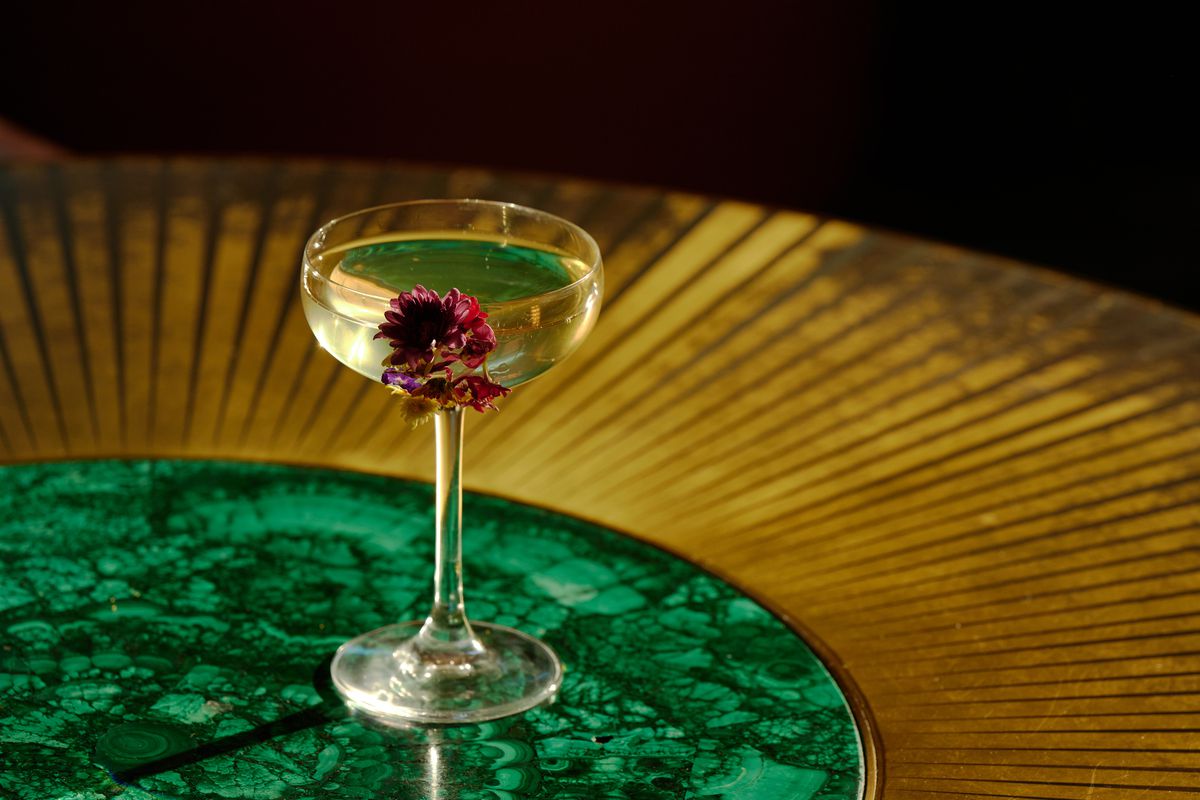 A cocktail with edible flowers.