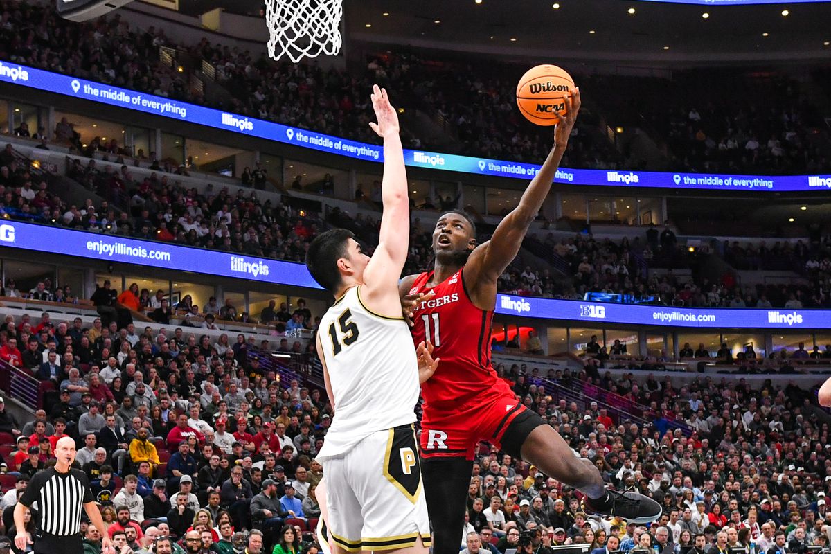 Clifford Omoruyi of the Rutgers Scarlet Knights attempts a shot over Zach Edey of the Purdue Boilermakers during the second half of a Big Ten Men’s Basketball Tournament Quarterfinals game at United Center on March 10, 2023 in Chicago, Illinois. The Purdue Boilermakers won the game 70-65 over the Rutgers Scarlet Knights.