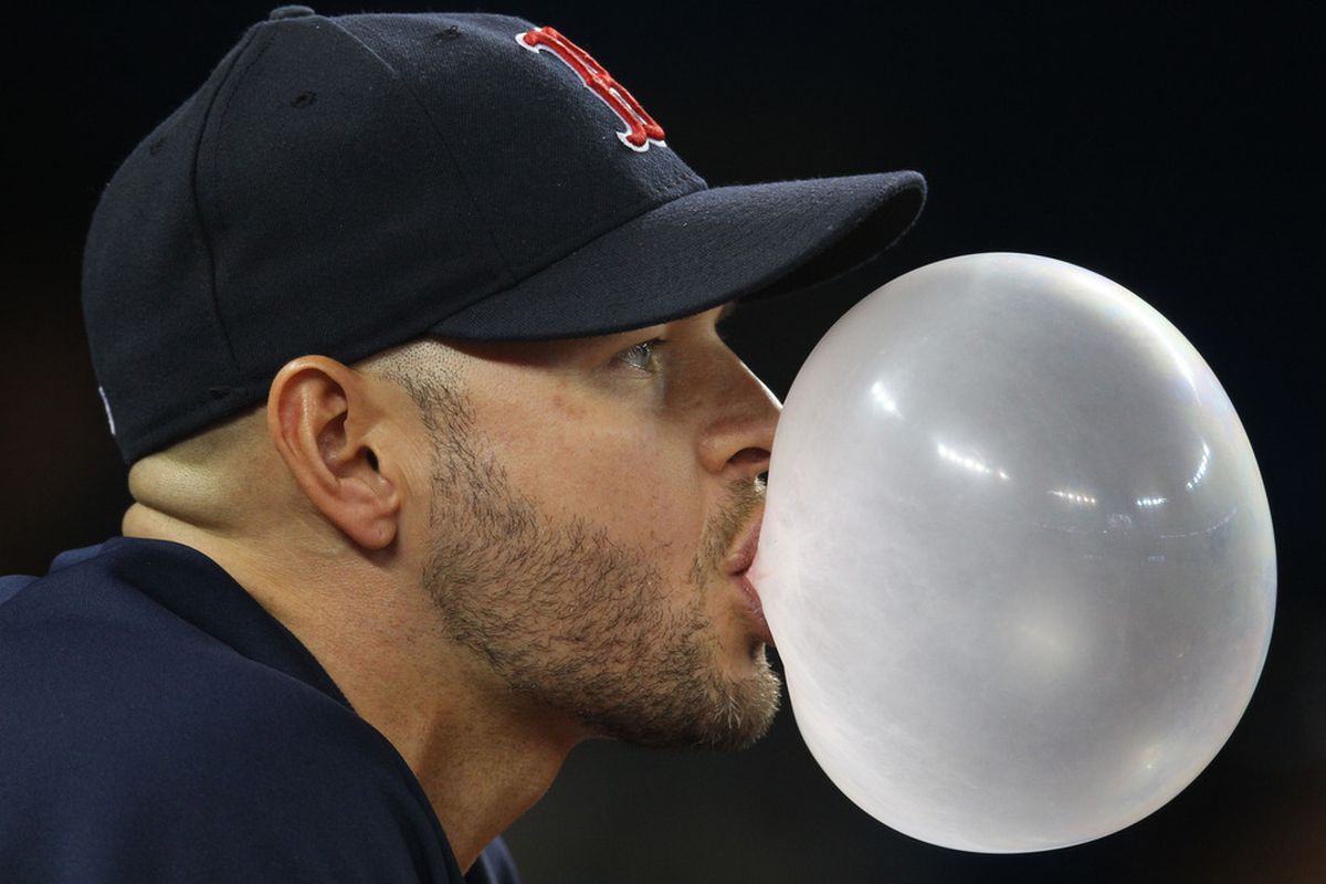 Toronto, ON, Canada; Boston Red Sox outfielder Cody Ross (7) blows a bubble during their game against the Toronto Blue Jays at the Rogers Centre. Mandatory Credit: Tom Szczerbowski-US PRESSWIRE